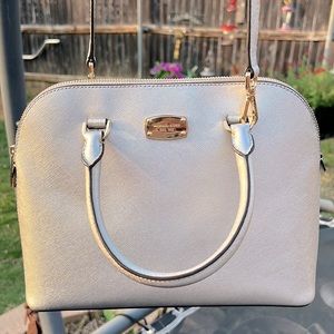Small Silver Michael Kors purse with gold accents
